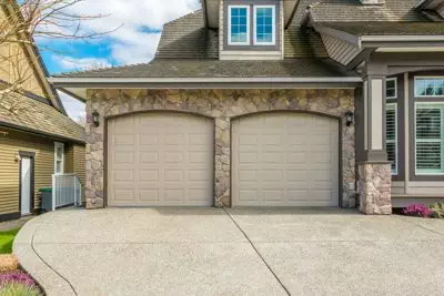 tan traditional two car garage